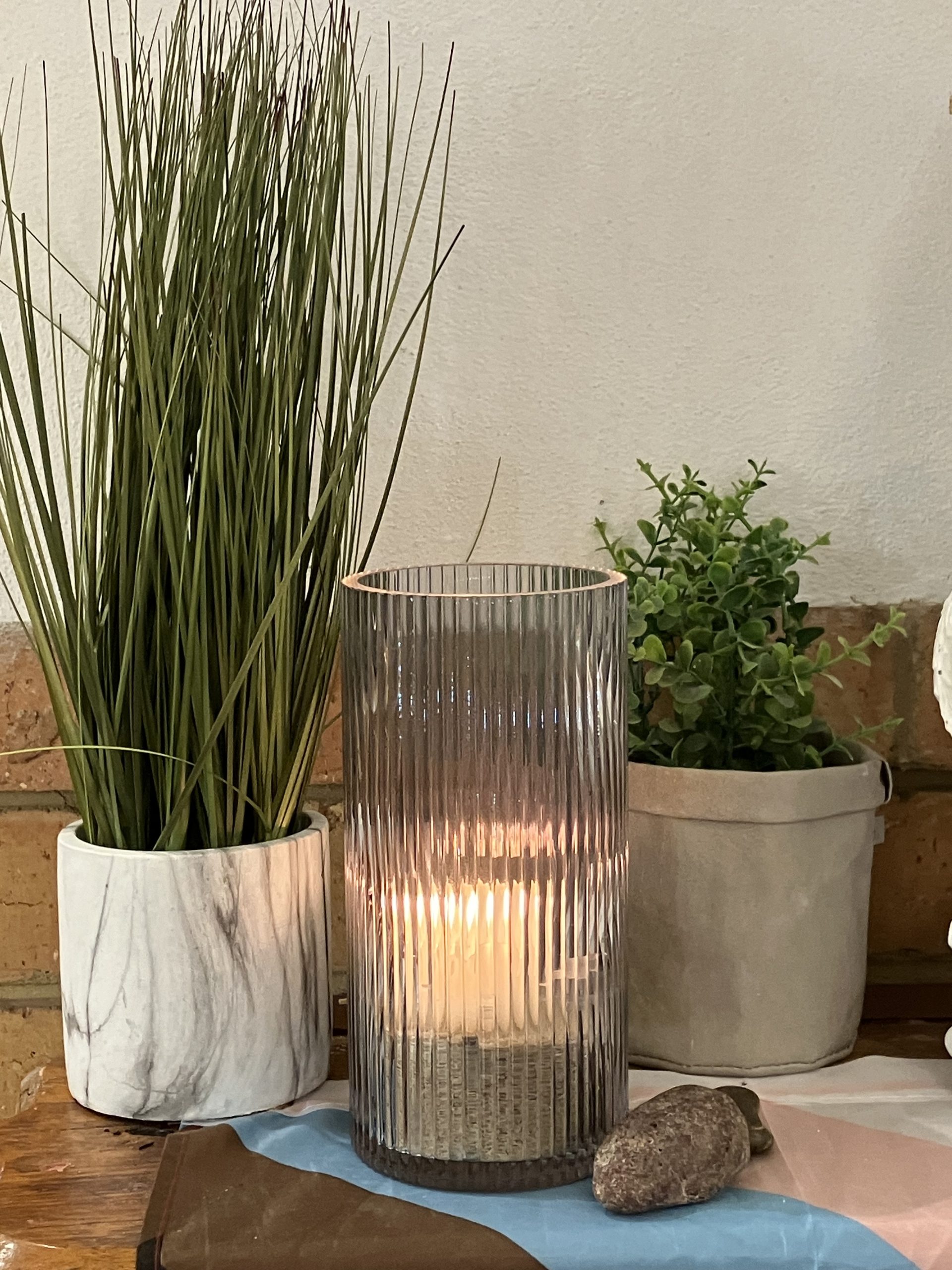candle rock and grasses
